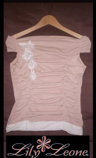 Off the shoulder light peach and white top.