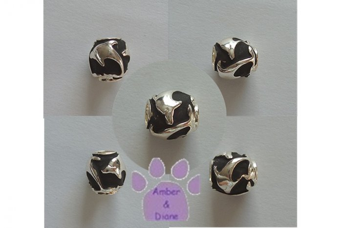 Sharks in Relief Sterling Silver Slider or Bead against black background