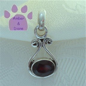 Garnet Oval Sterling Silver Pendant in a simple frame