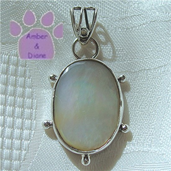 Mother of Pearl Oval Sterling Silver Pendant in a simple frame