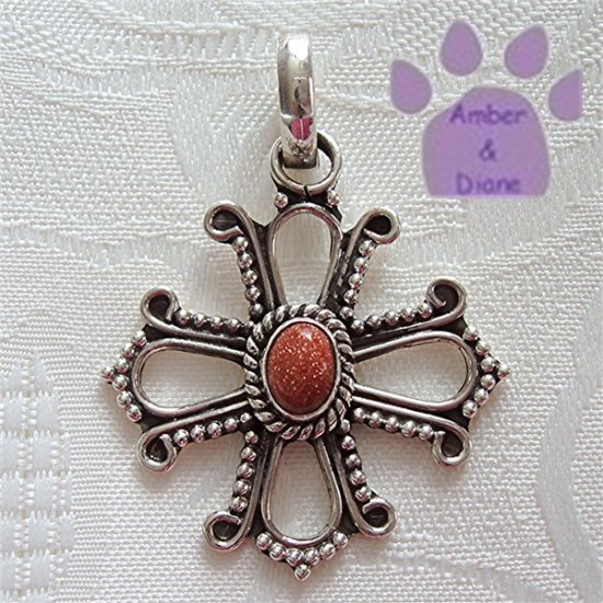Sunstone Oval Sterling Silver Pendant in an intricate cross frame