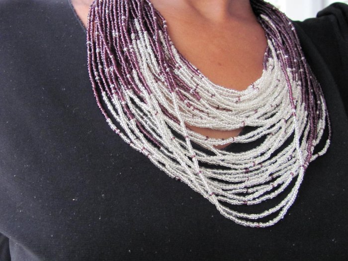 purple and white multi-string necklace