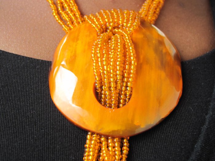 long orange multi-string necklace