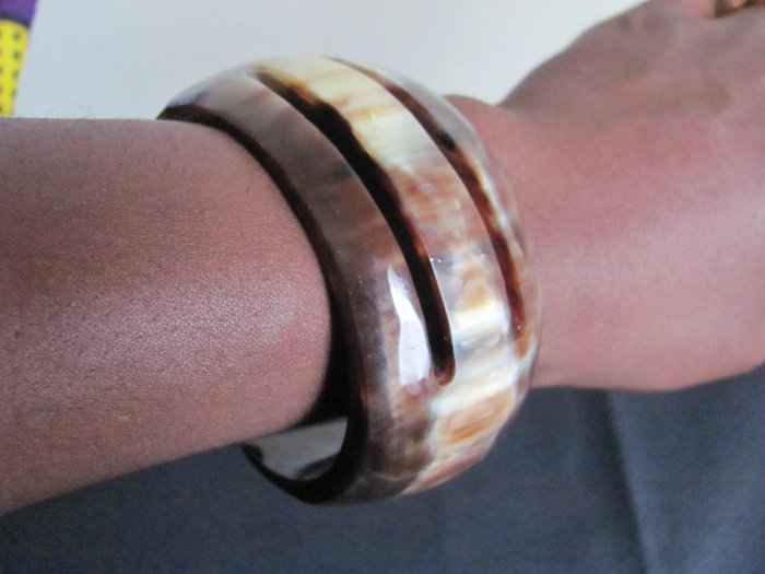 white and brown round bracelet