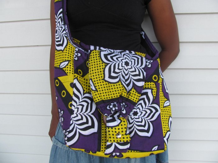 brown yellow and white hand bag