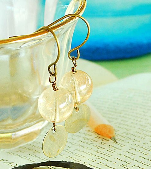 Nice and clear bead with little bronze coin