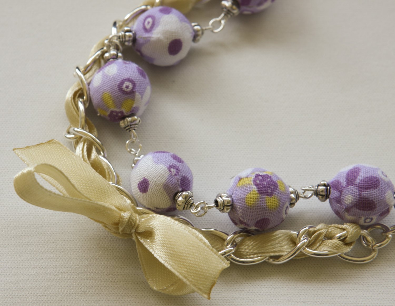 Violet cotton beads and yellow satin ribbon bracelet