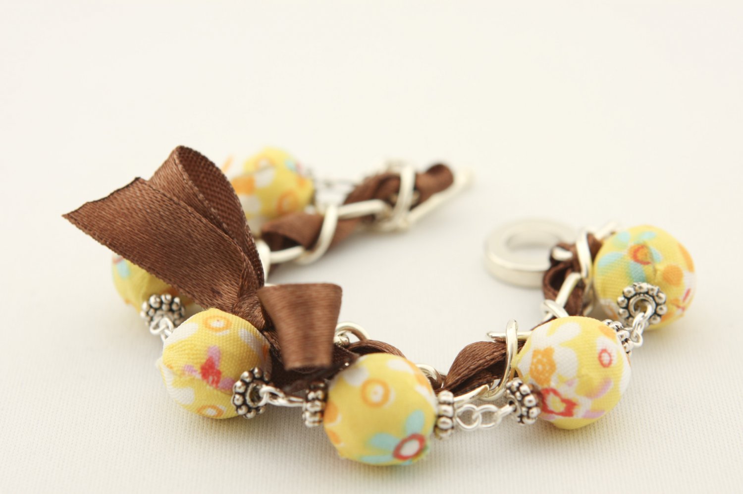 Yellow floral cotton beads and brown satin ribbon bracelet