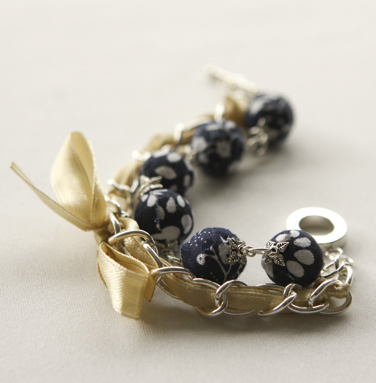 Dark blue fabric beads and yellow satin ribbon bracelet