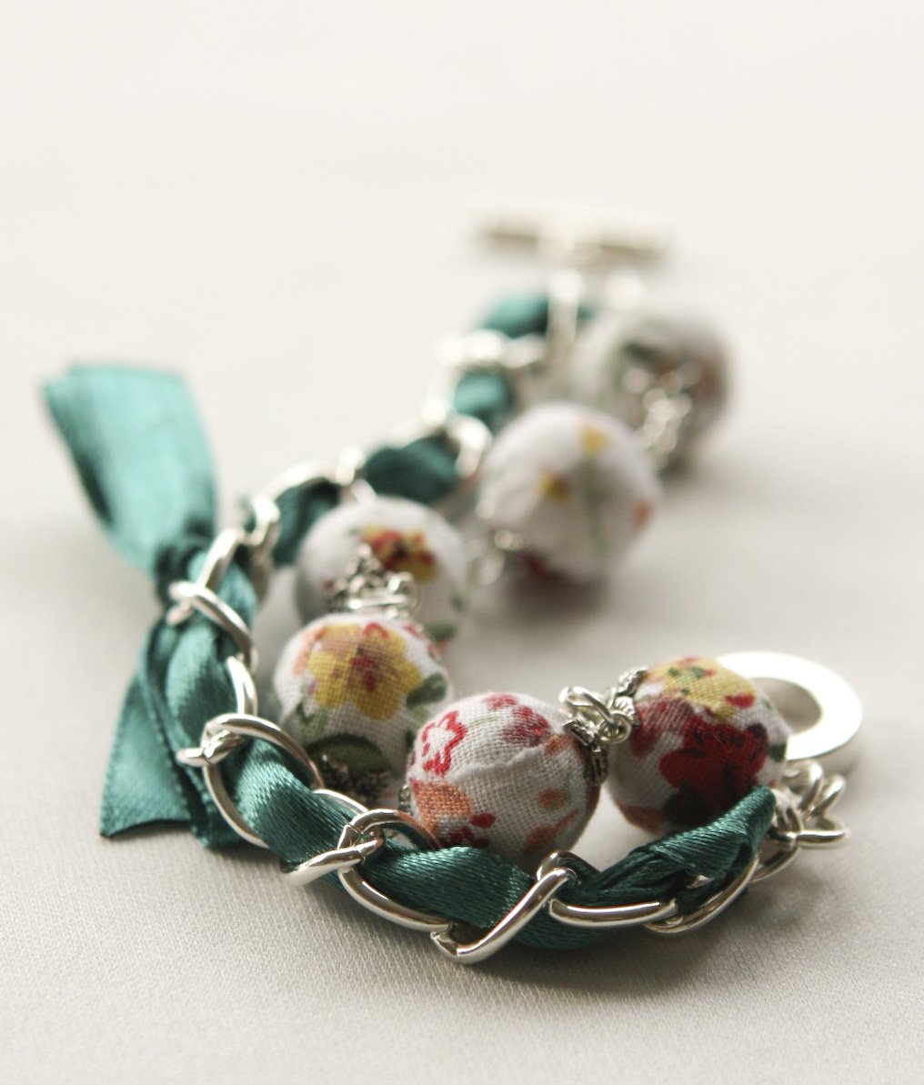 White floral fabric beads and emerald satin ribbon bracelet