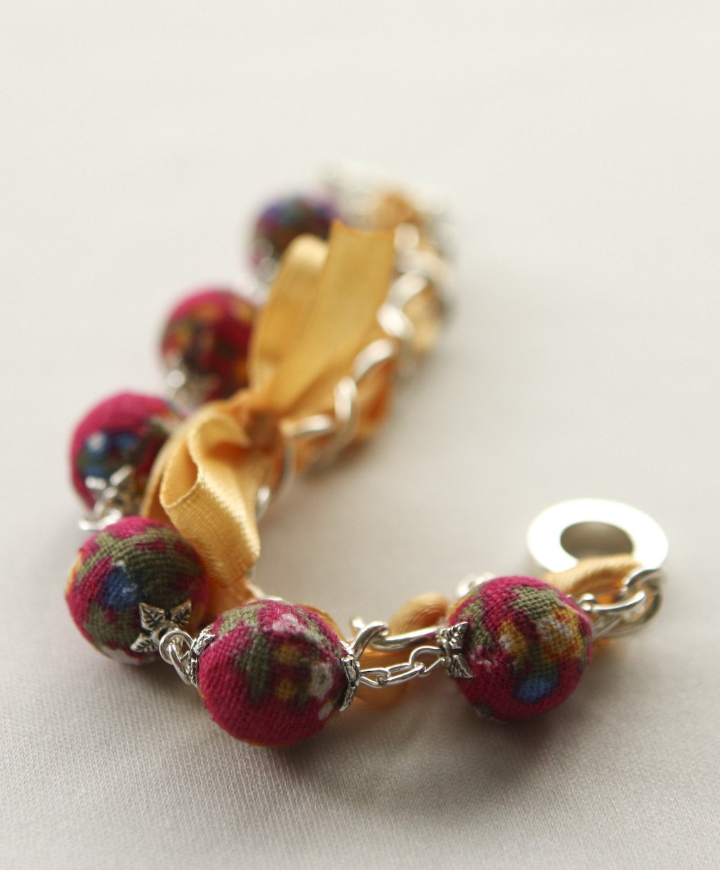 Red cotton beads and yellow satin ribbon bracelet
