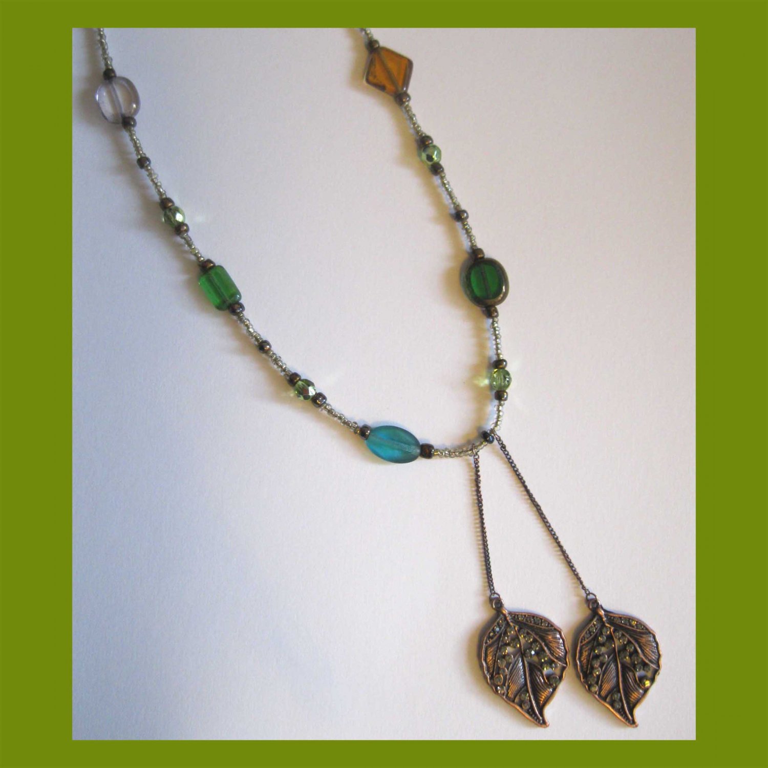 Browns and greens one of a kind fashion necklace with double leaf pendants