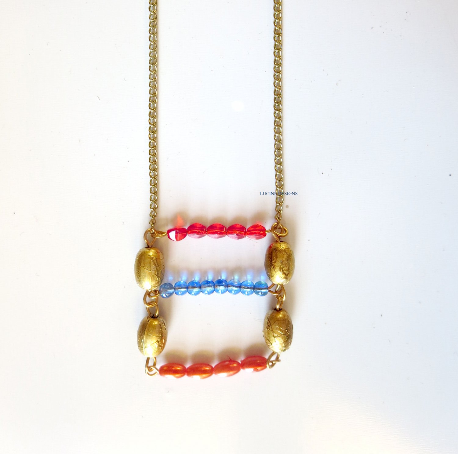 Red blue orange and gold trendy fashion necklace by Lucine