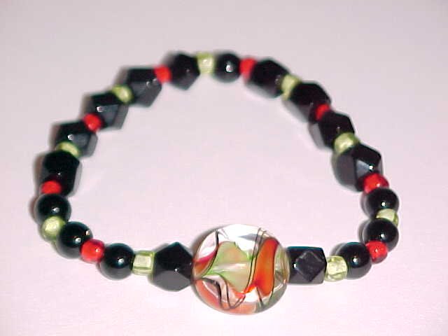 (SOLD) Red, Black, Green Swirl Beaded Stretch Bracelet 7 inches