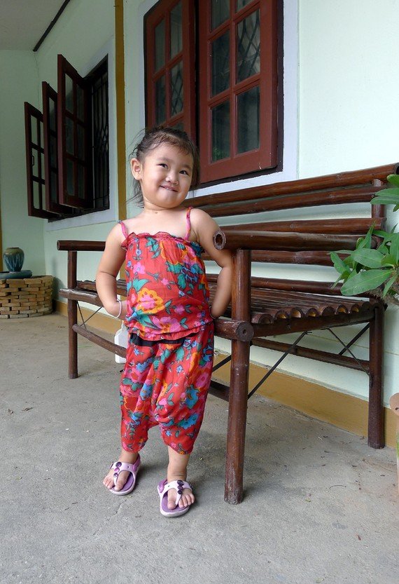 Funky colourful toddler childrens clothing. 2 to 3 years. Adjustable size. Red 2 piece set.