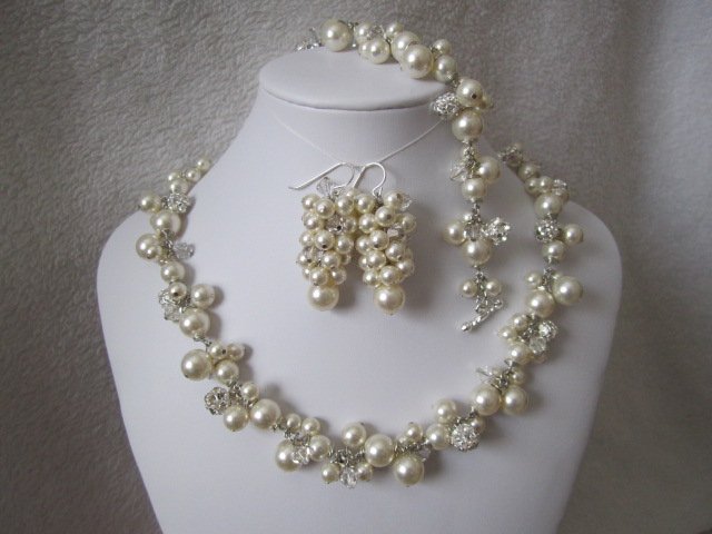 Set of bridal jewelry with earrings, necklace, and bracelet