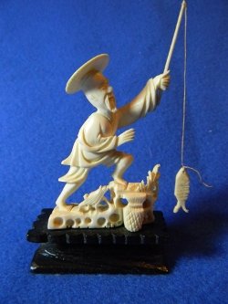 Antique pre-ban pure ivory Chinese fisherman carving on ebony wood base