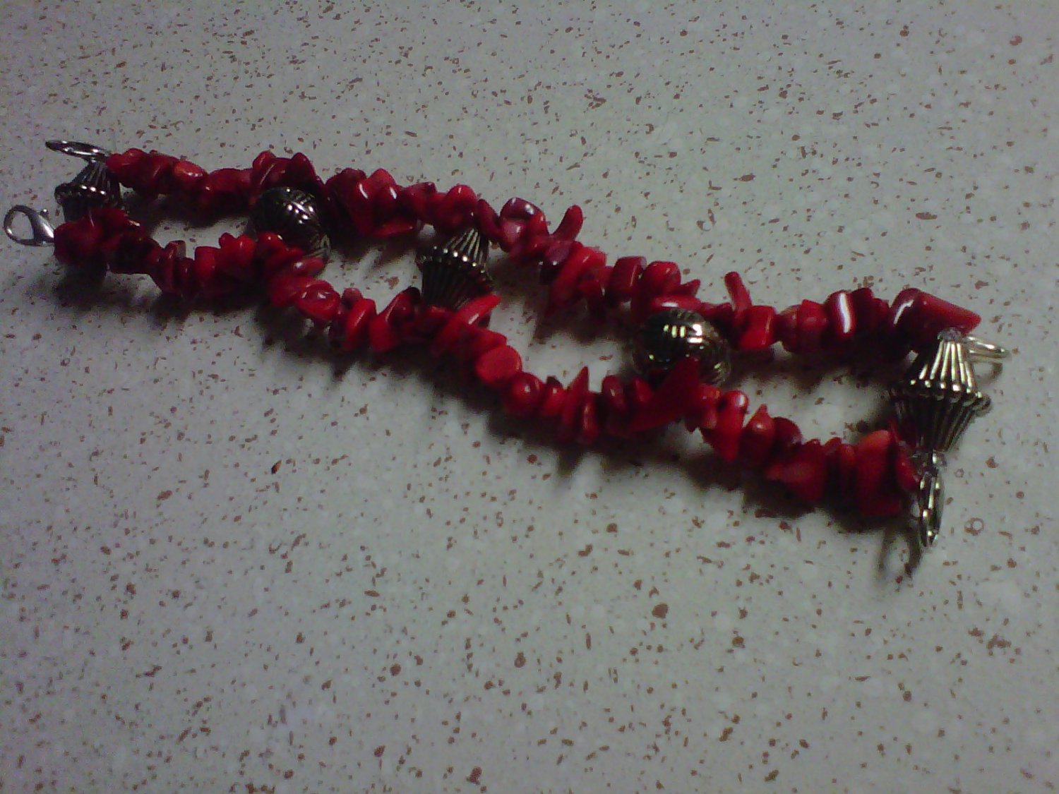 red and silver watch band/ bracelet