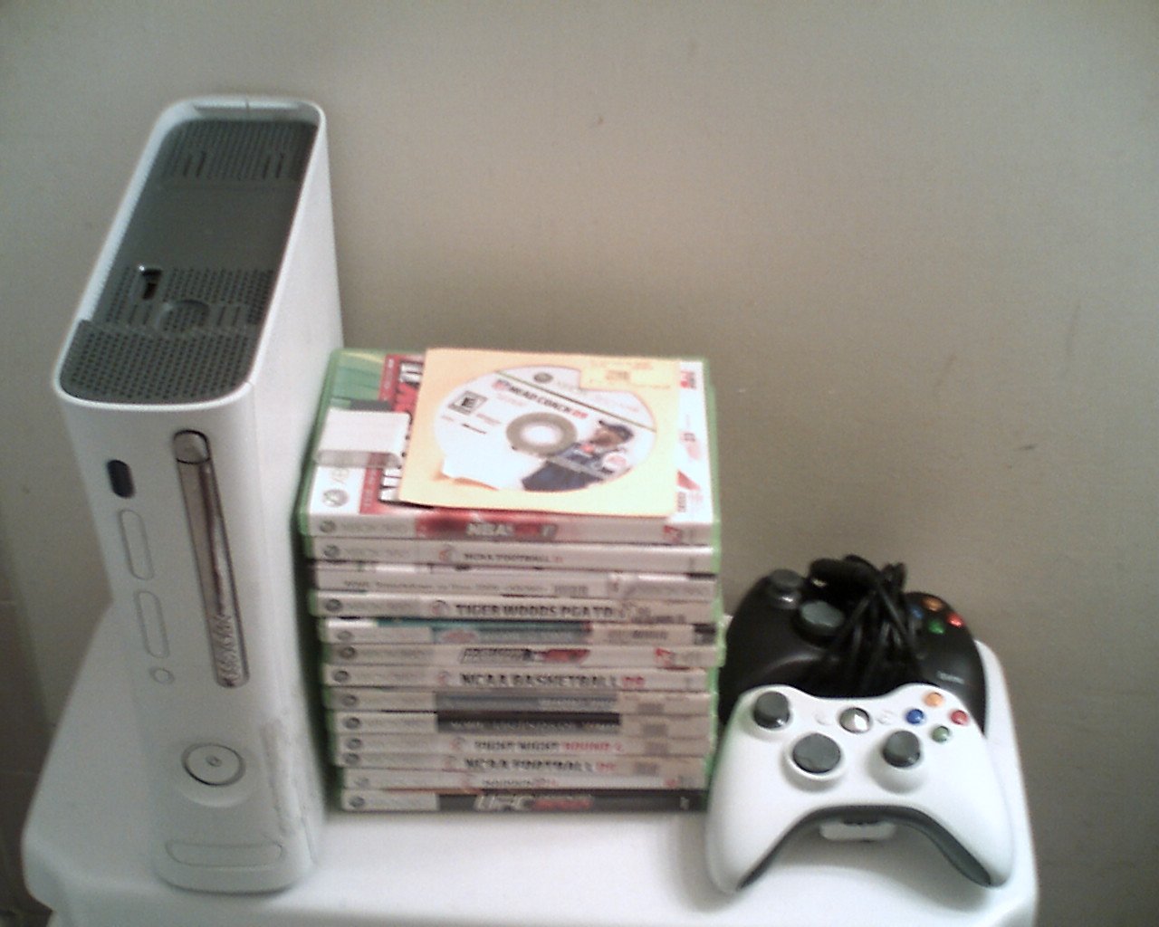 xbox 360 with 14 top selling games and 2 contollers