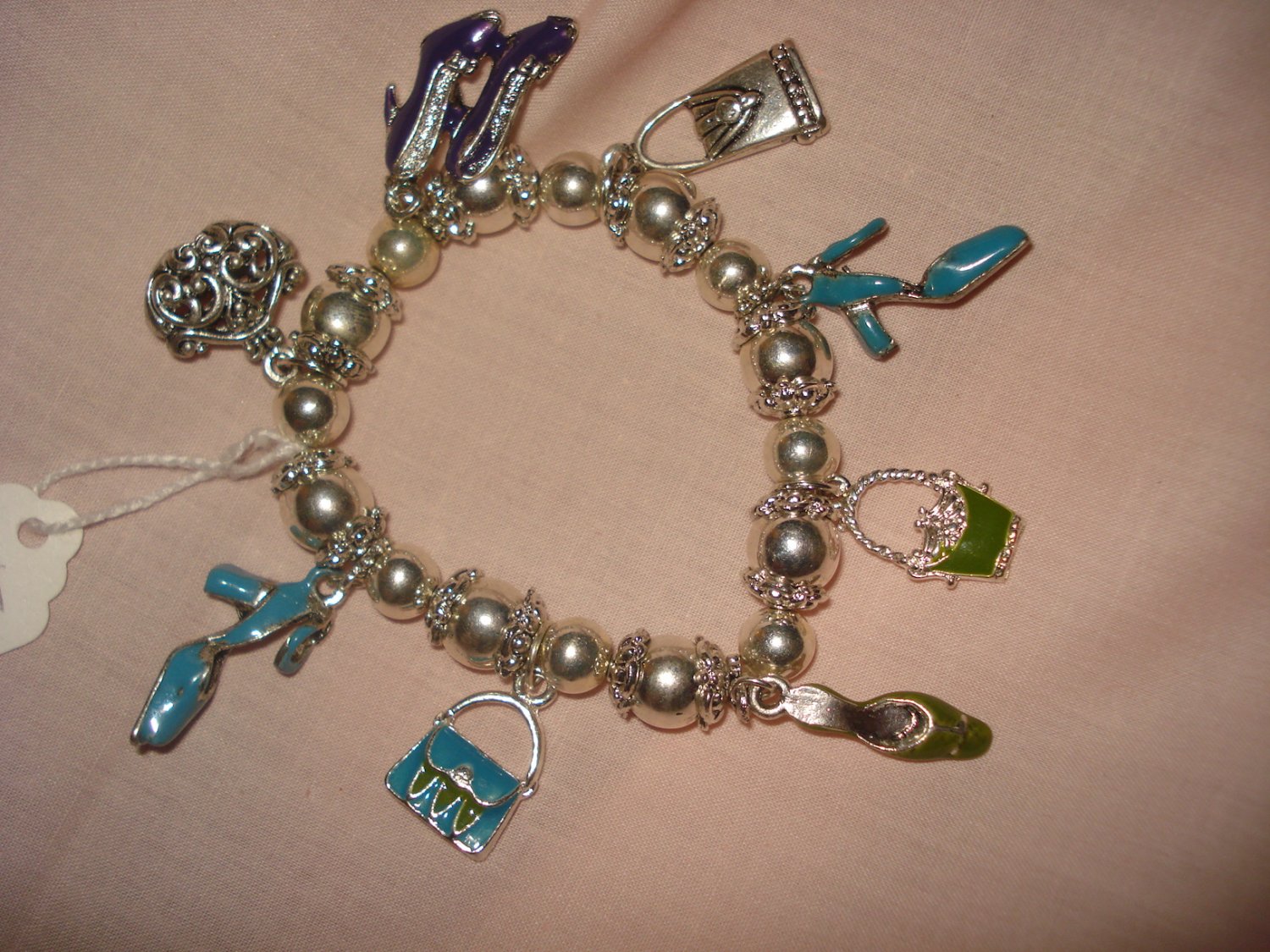 Silver stretch bracelet with enameled purse & shoe charms - eg23