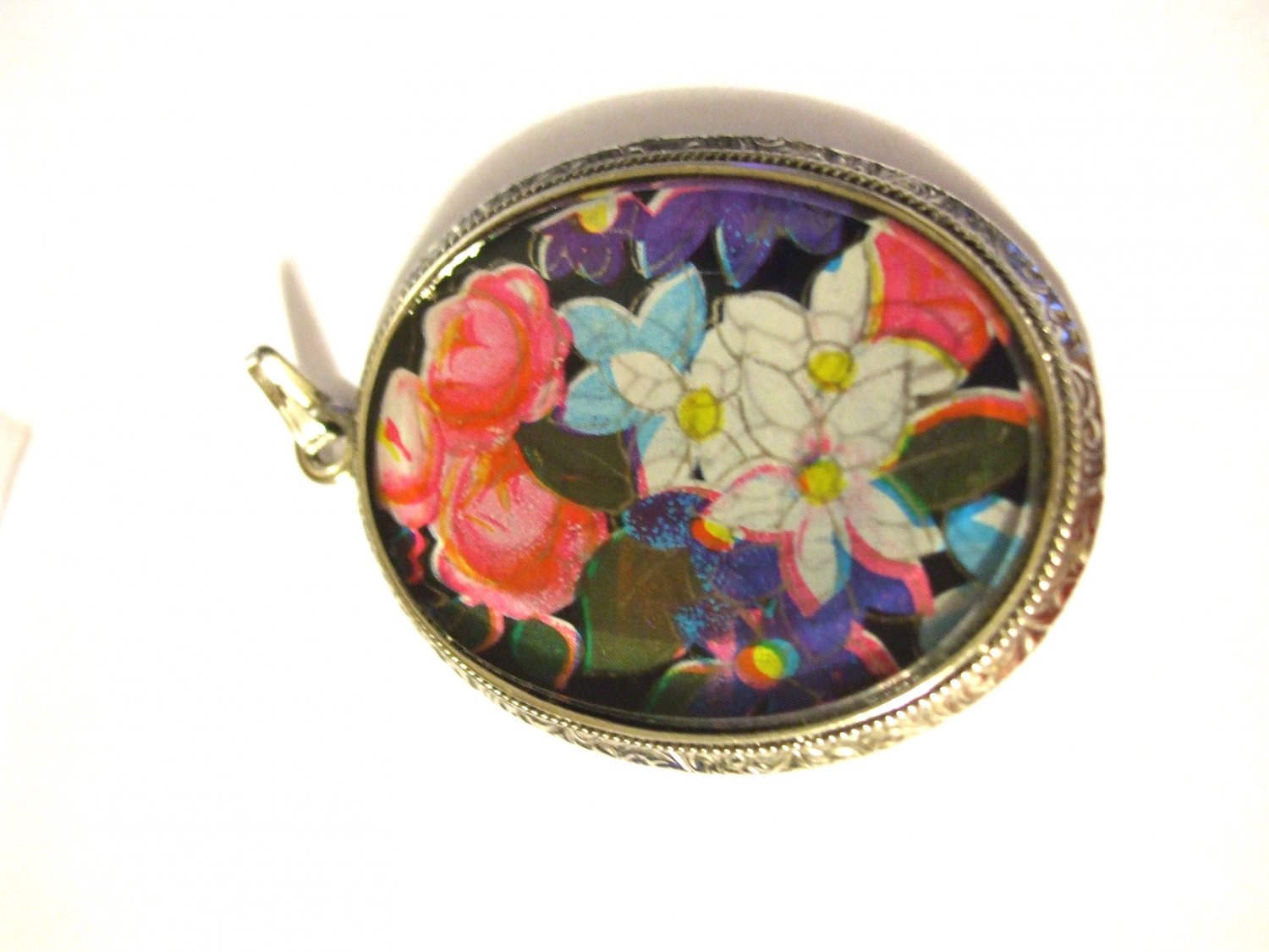 Siver Toned Pendant with Flowers under Glass with Silver tone painting of outline of Flowers