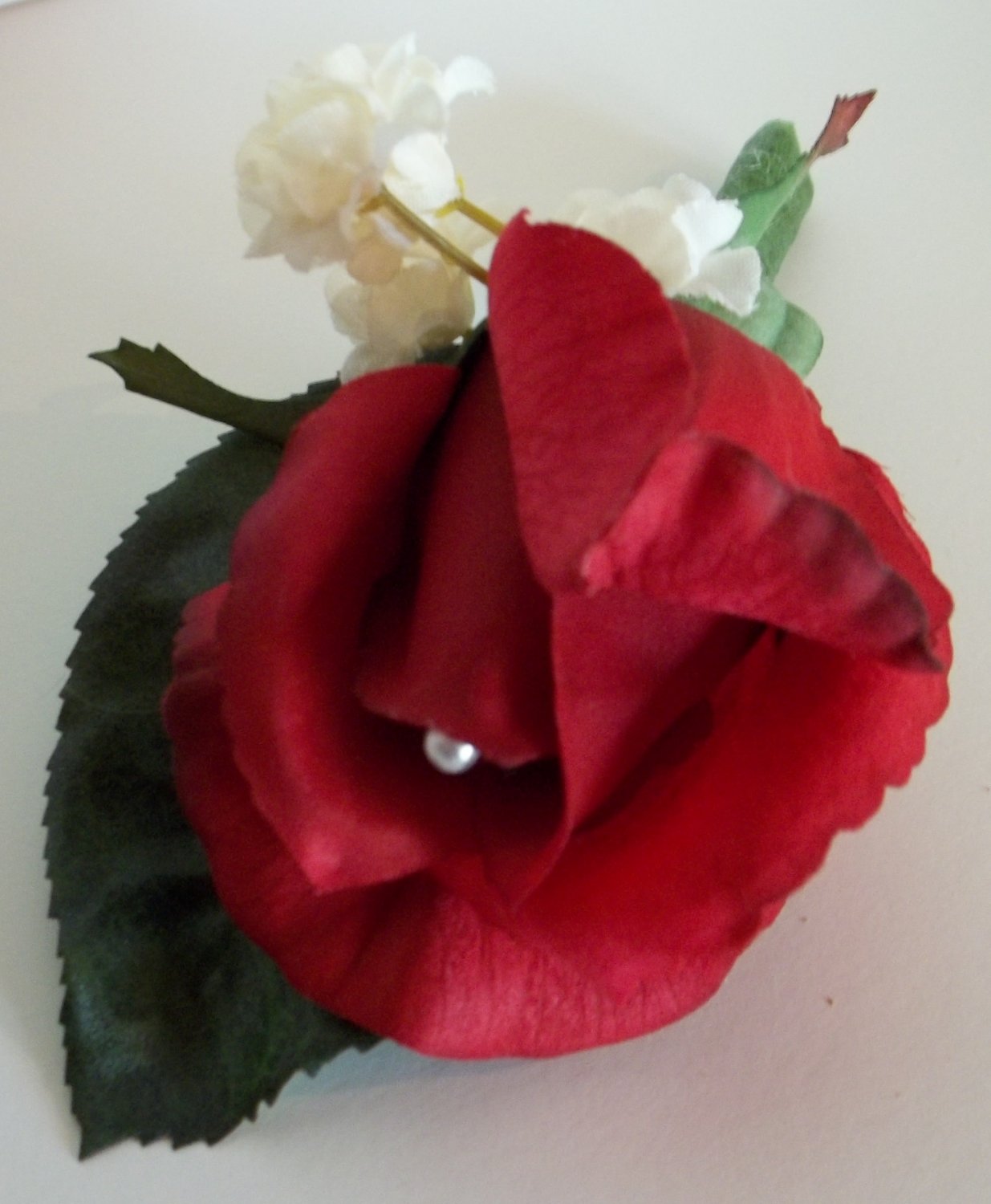 True Touch Boutonniere. Single Rose bud with pearl pin accent.From Customweddingdesigns