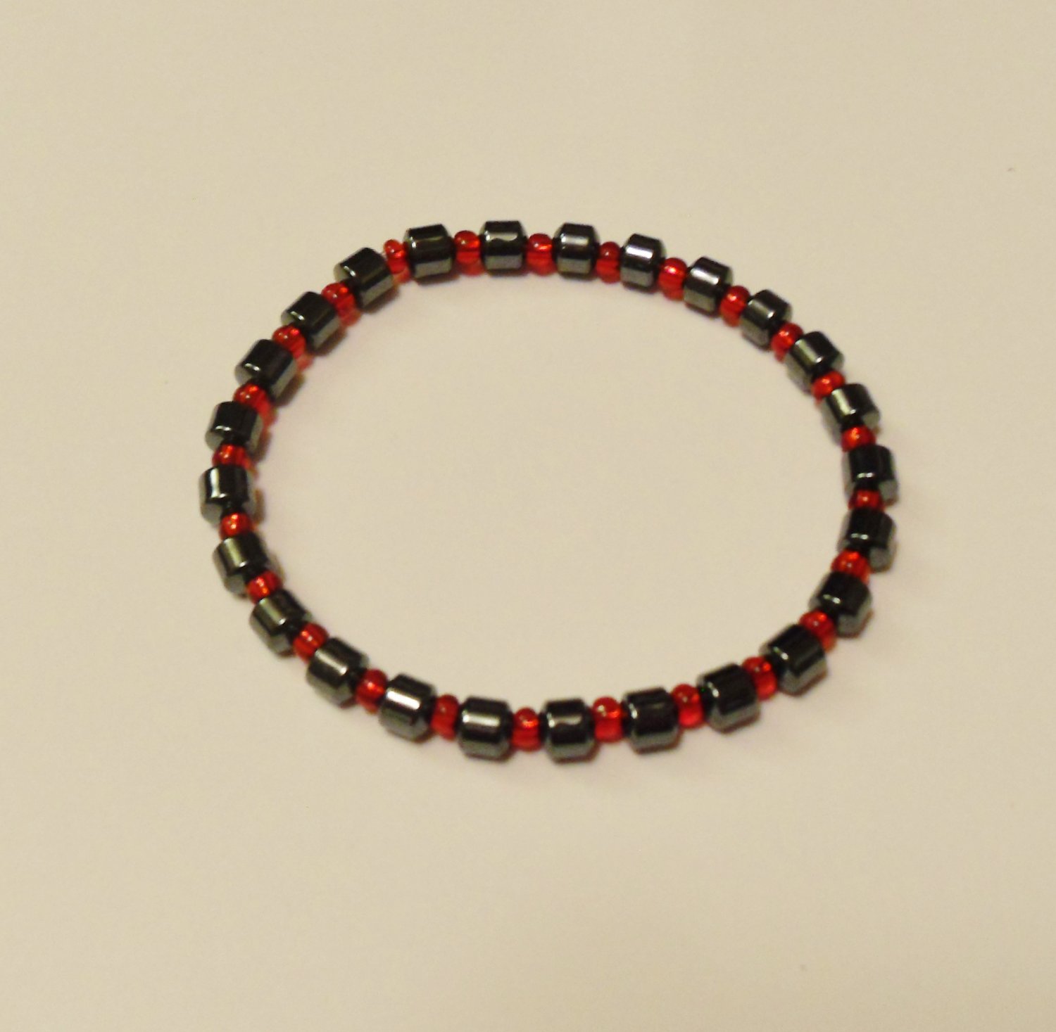 Hematite and clear red surfer bracelet