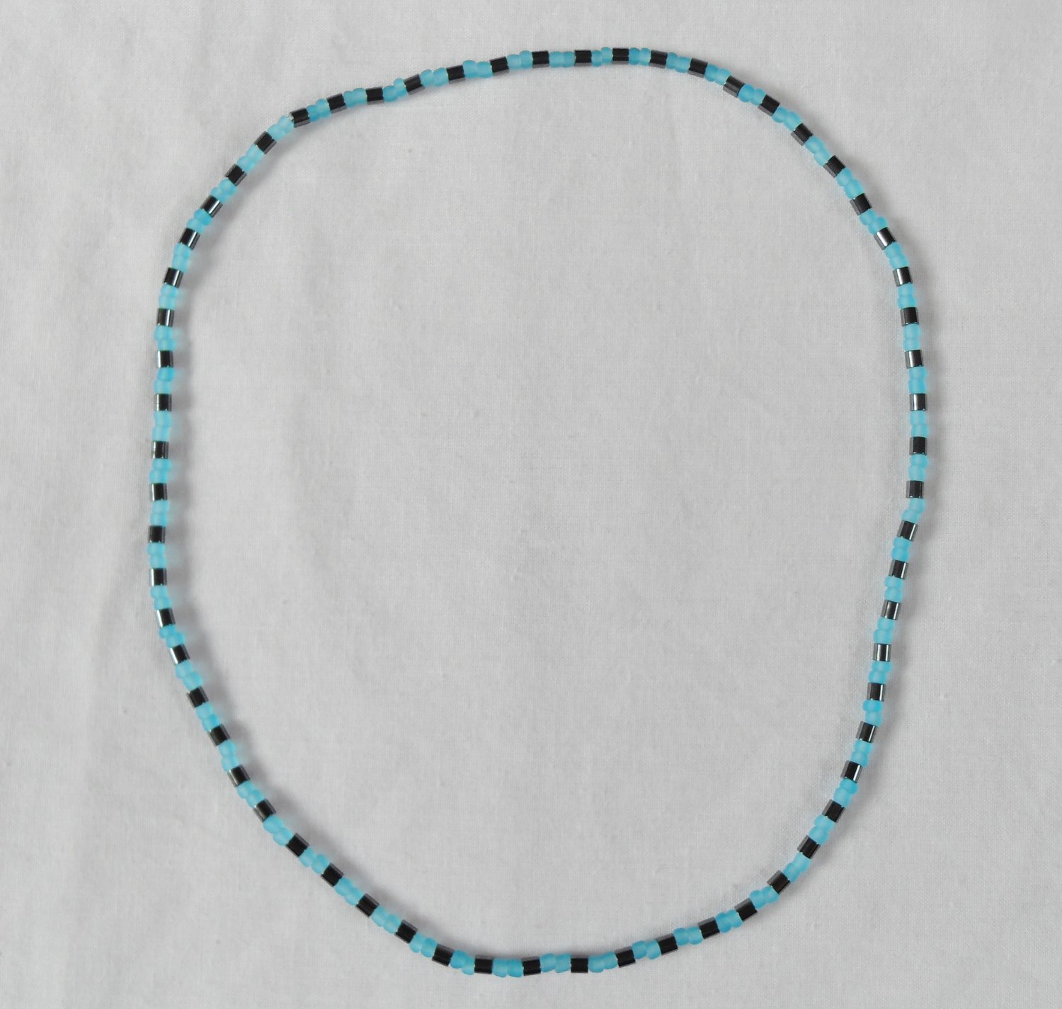 Hematite and opaque blue stretchy surfer necklace