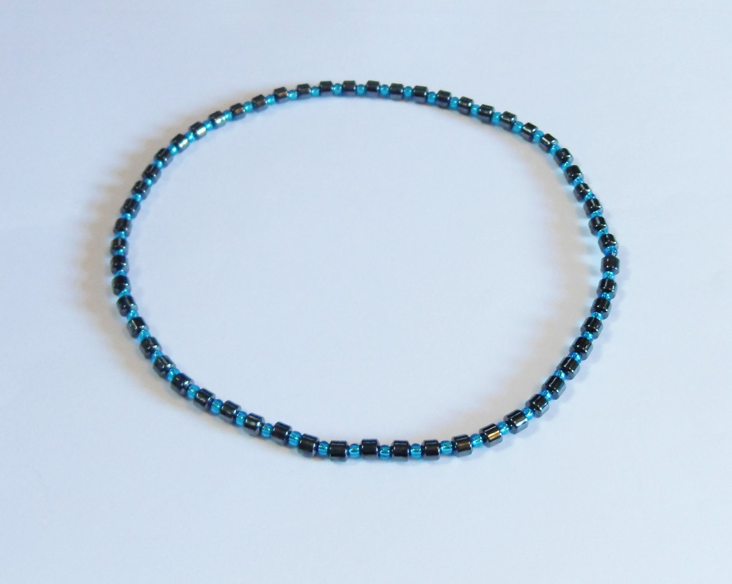 Hematite drum and clear blue stretchy surfer necklace