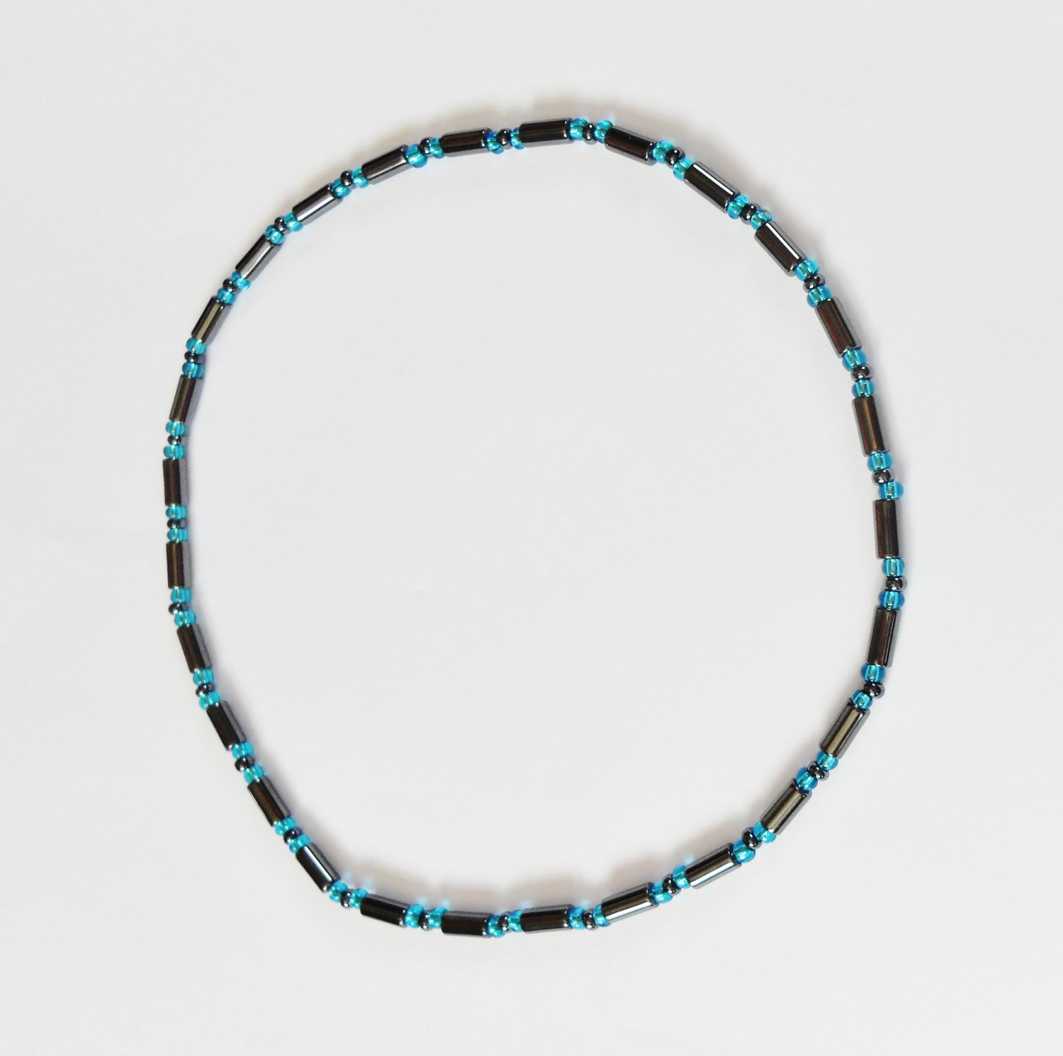 Long drum hematite and clear blue stretchy surfer necklace