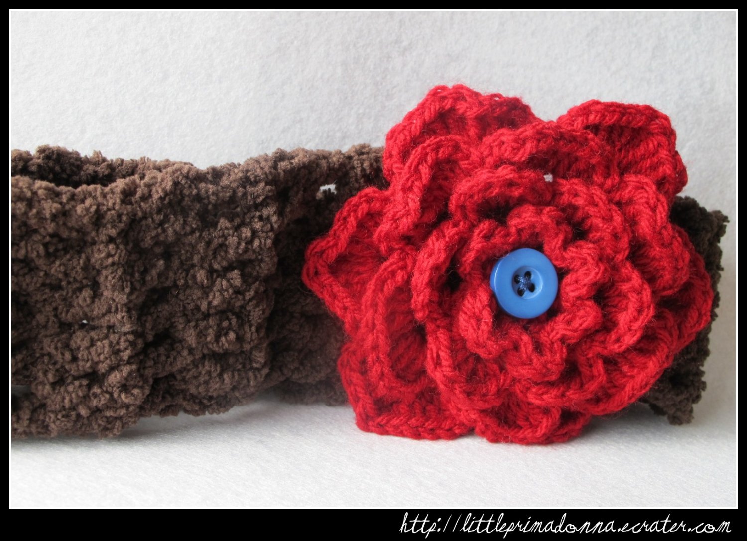 Crocheted headband with large red flower