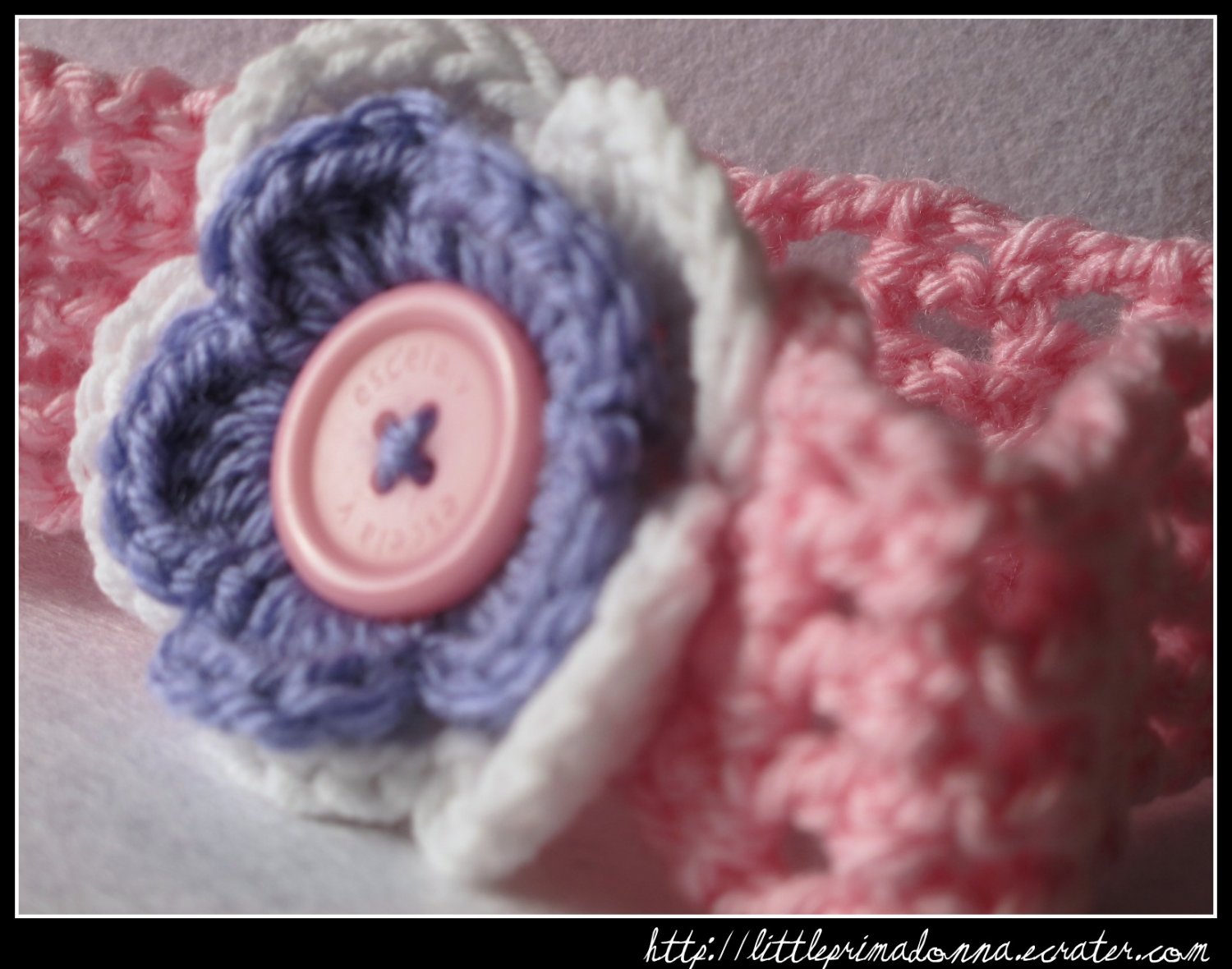 Crocheted headband with layered flower for baby