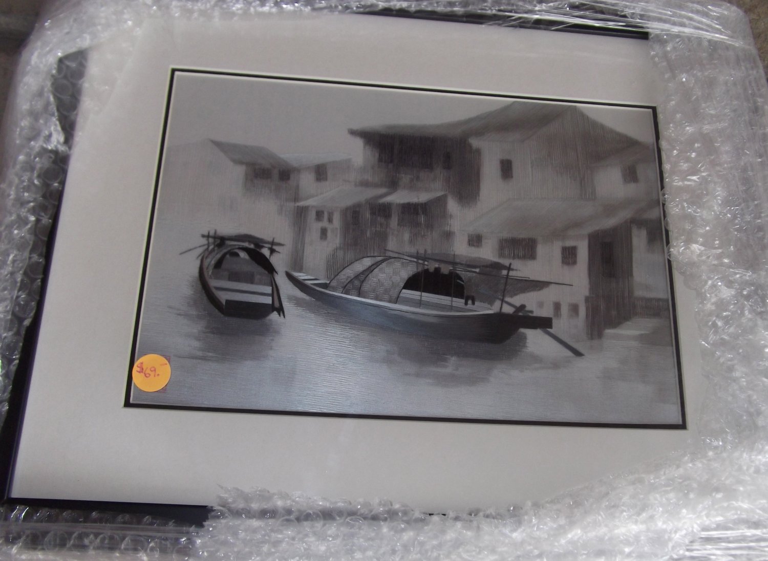 Boat on river with house in background