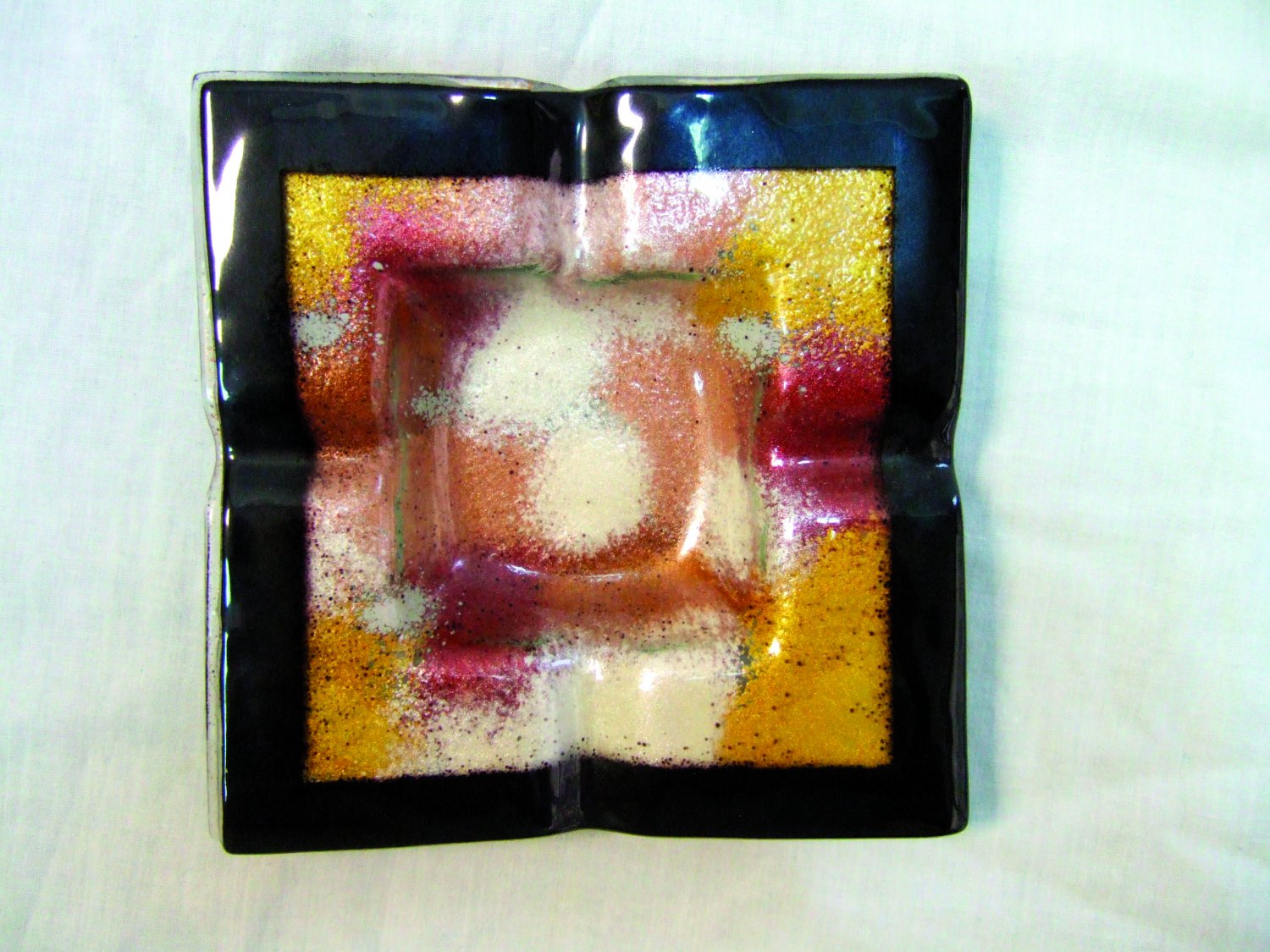 Fused glass metallic dust ashtray