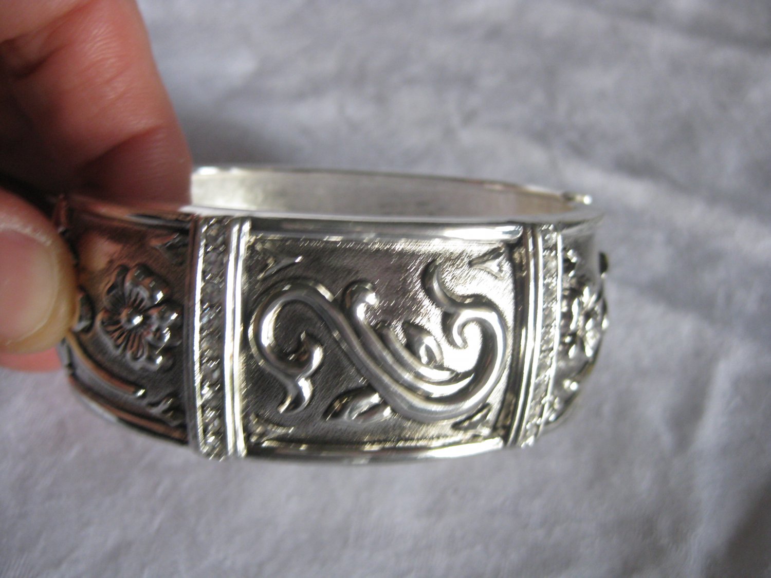 Silver cuff with rhinestones and flowers