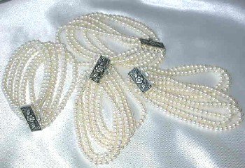 Wholesale 4 pcs. Grade AA 5-rows white pearl silver clasp bracel