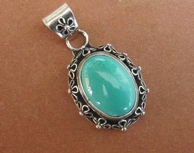Turquoise pendant on sterling silver setting