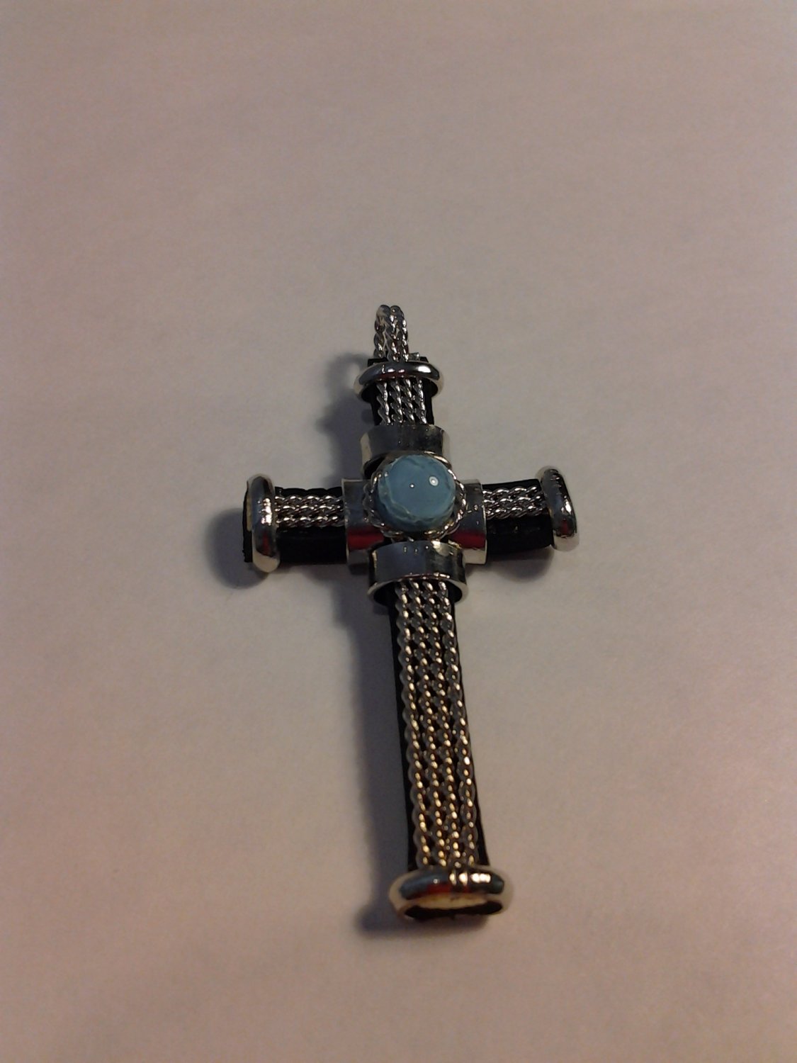 Brand New Beautiful Pendant Cross with a light blue Stone in the middle