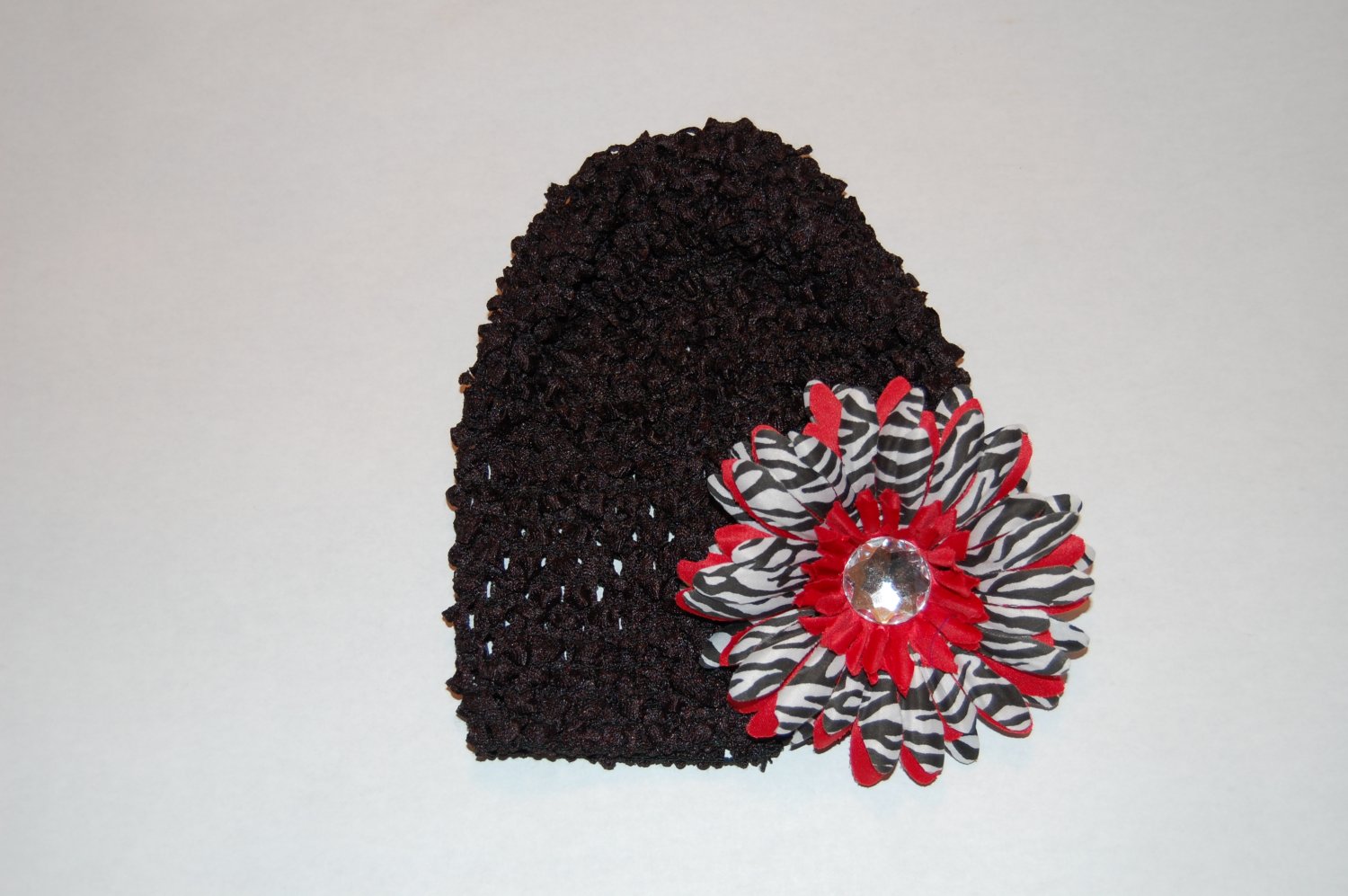 Crocheted Black Hat with Red Stacked Zebra Daisy