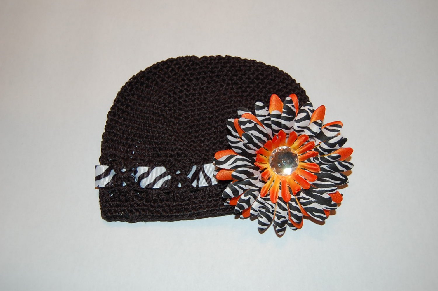 Crocheted Kufi Hat,Black, Zebra Ribbon Accent, Orange Zebra Daisy . Sizes NB, SM, MED, LGE