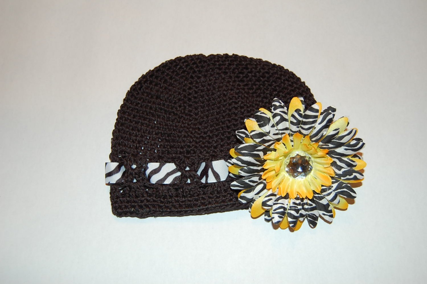 Crocheted Kufi Hat,Black, Zebra Ribbon Accent, Yellow Zebra Daisy . Sizes NB, SM, MED, LGE