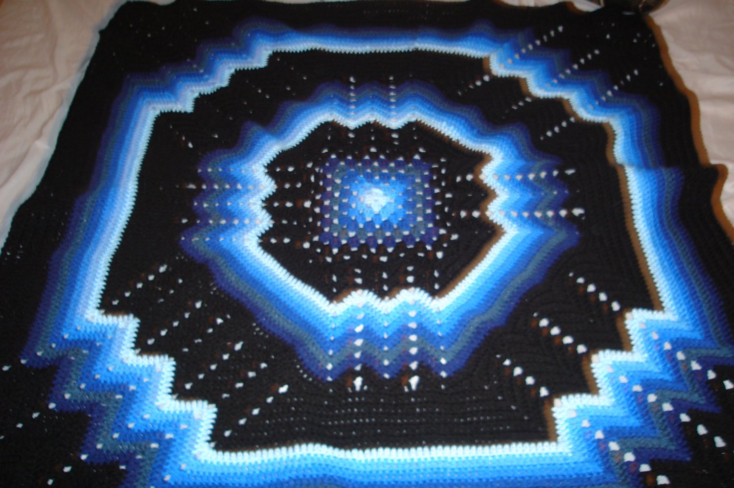 multi-colored blue & black afghan