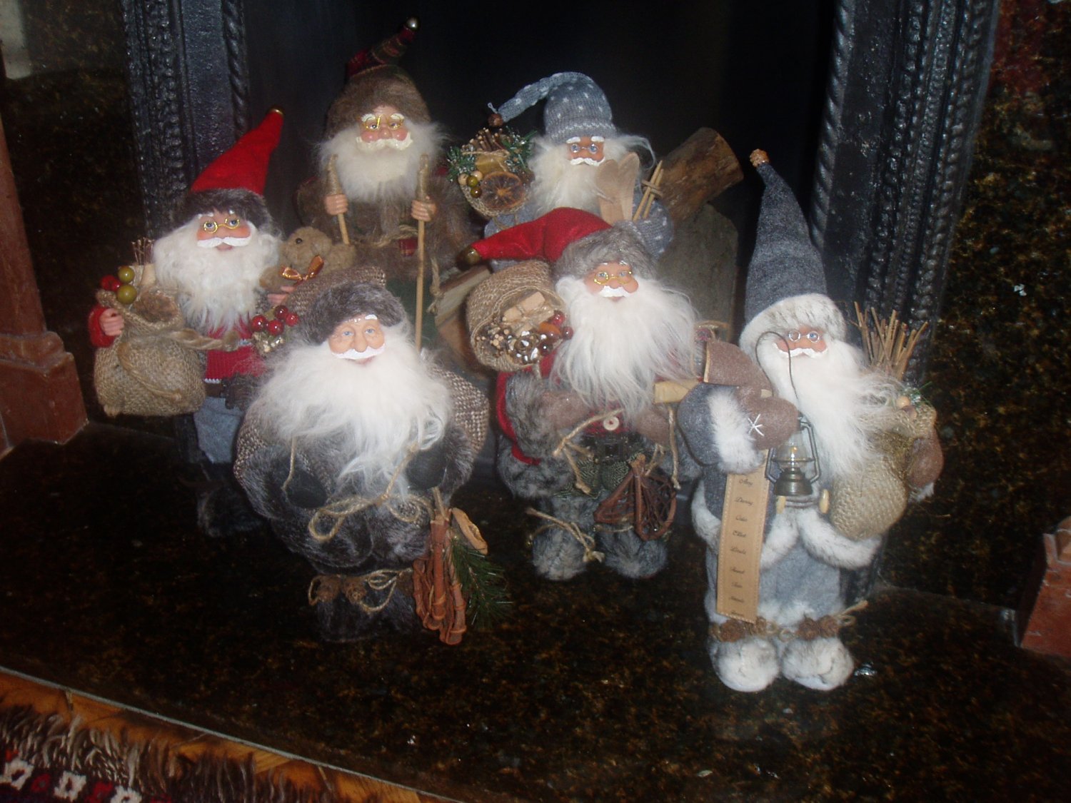 group of father christmas figures