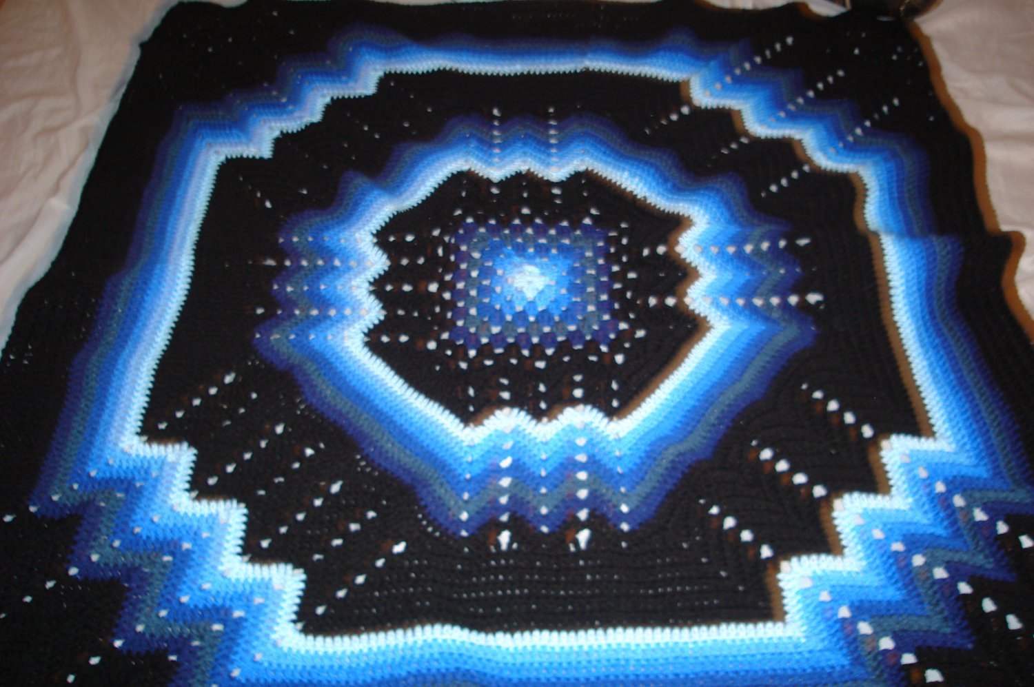 multi-colored blue & black afghan