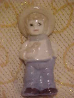CHARMING PORCELAIN BOY WITH BIRD FIGURINE