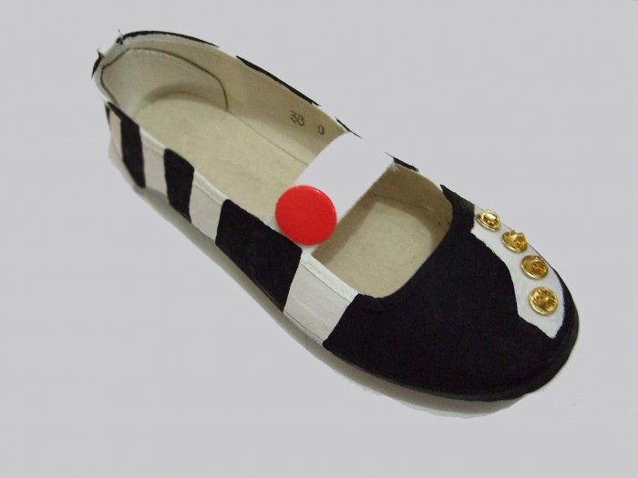 Black and white with gold studs.