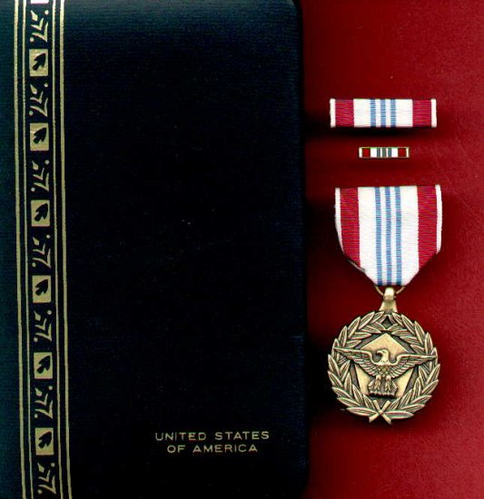 US Defense Meritorious Service medal in case with ribbon bar and lapel pin