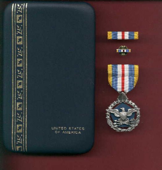 US Defense Superior Service medal in case with ribbon bar and lapel pin