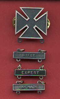 Marksman badge with three qualification bars