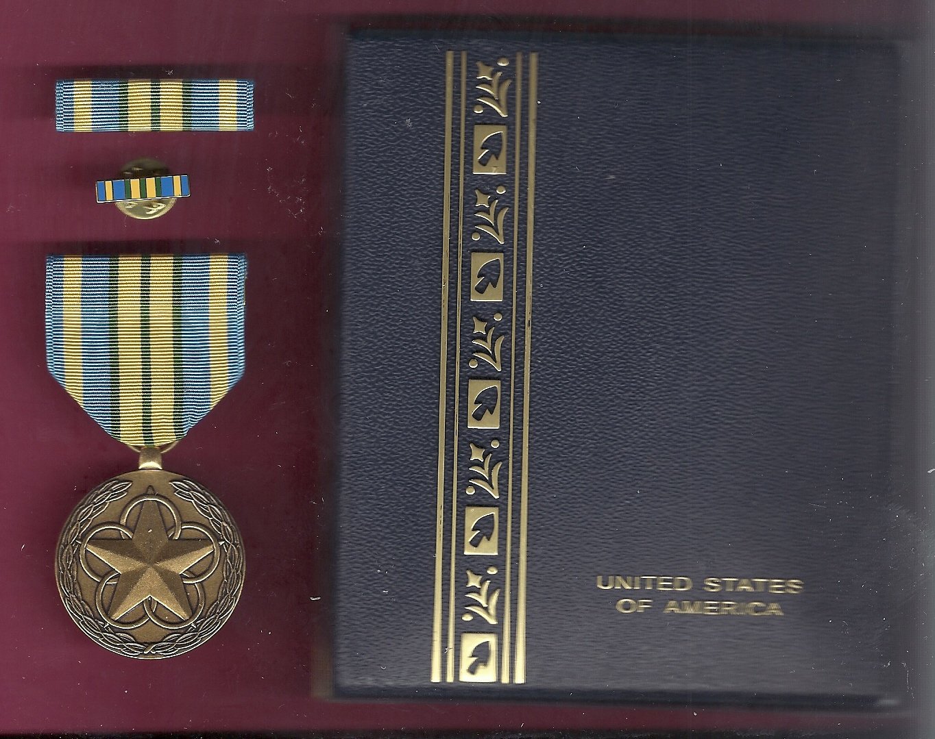 Outstanding Volunteer Service medal in case with ribbon bar and lapel pin